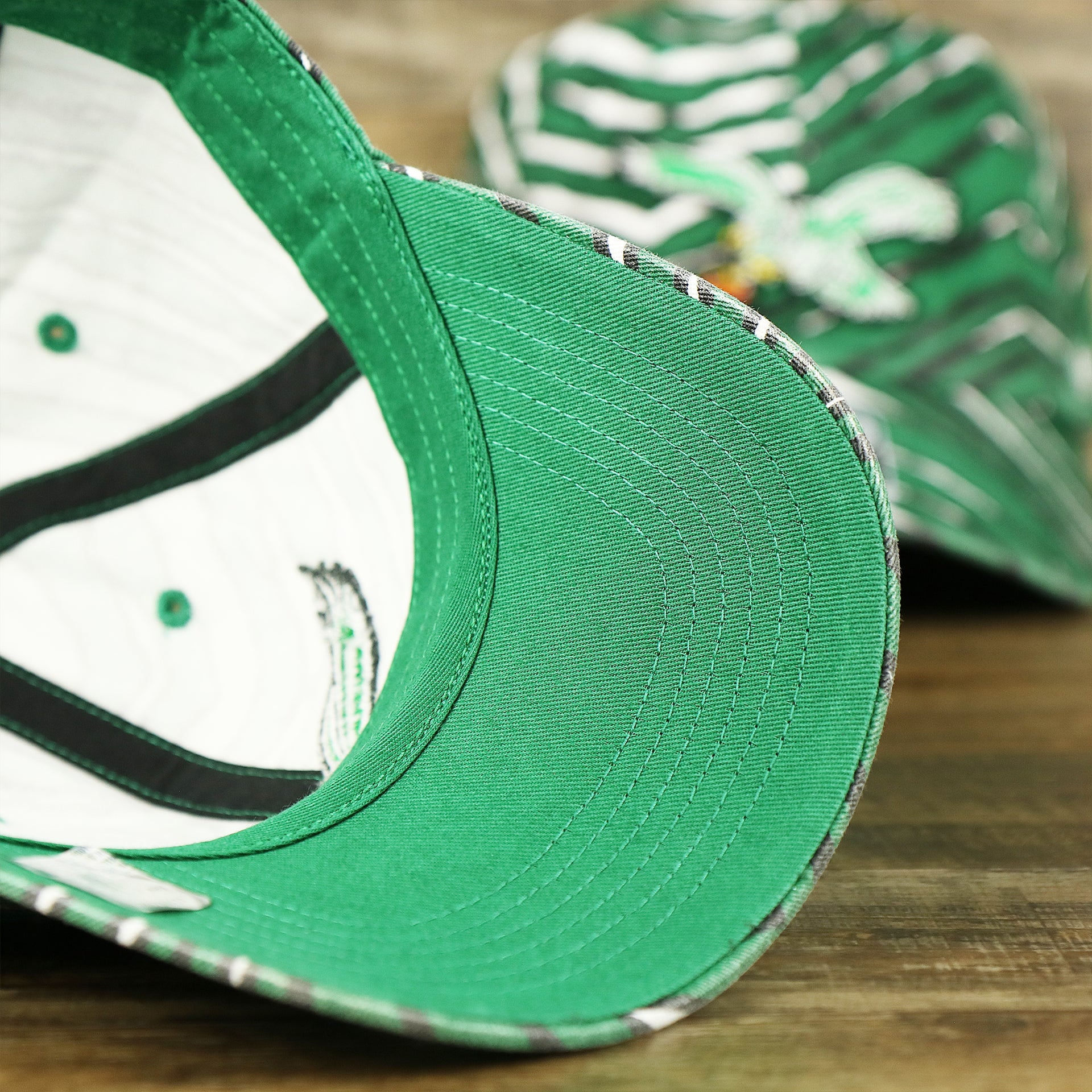 The undervisor on the Throwback Philadelphia Eagles Zubaz Striped Pattern Dad Hat | Kelly Green Dad Hat