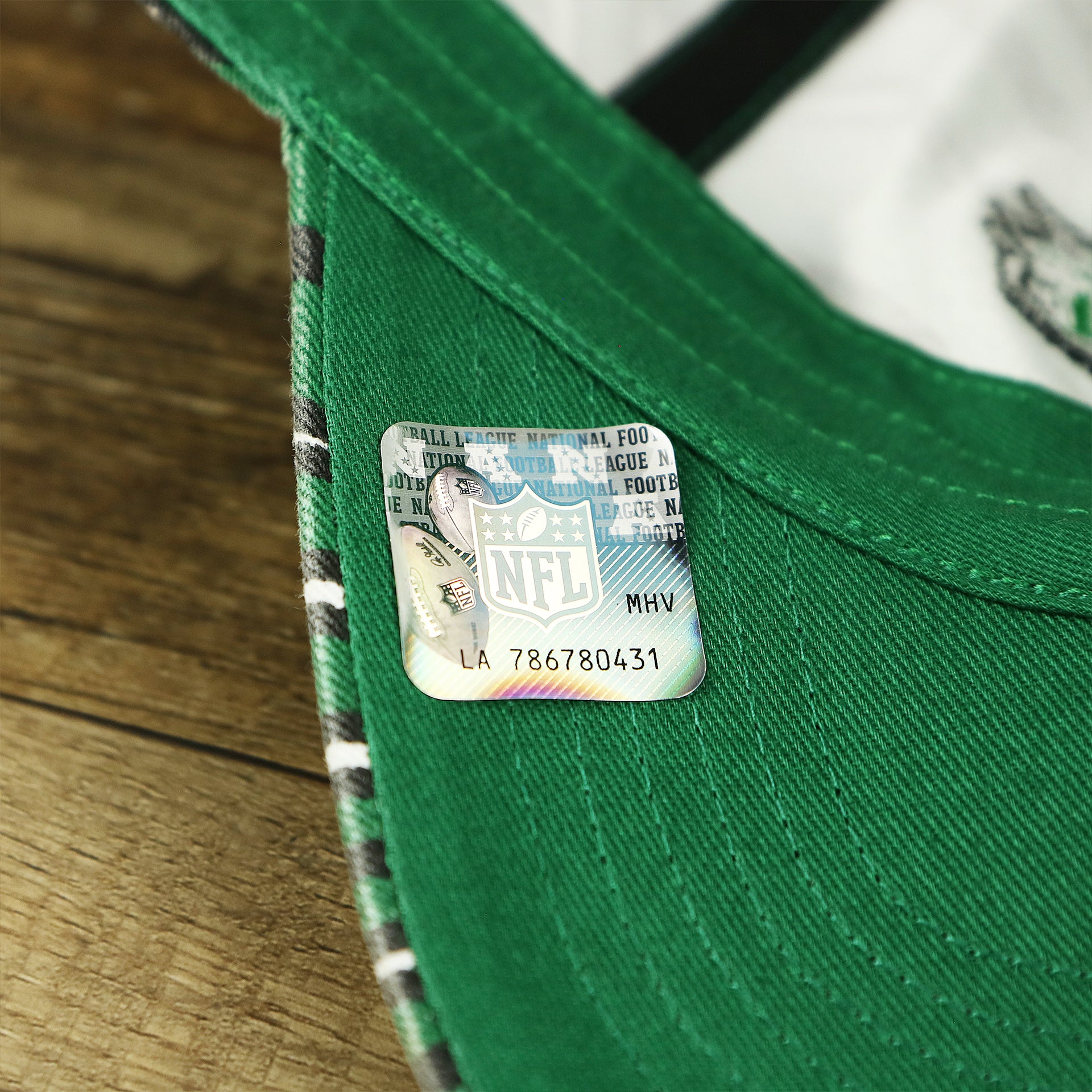 The NFL Sticker on the Throwback Philadelphia Eagles Zubaz Striped Pattern Dad Hat | Kelly Green Dad Hat