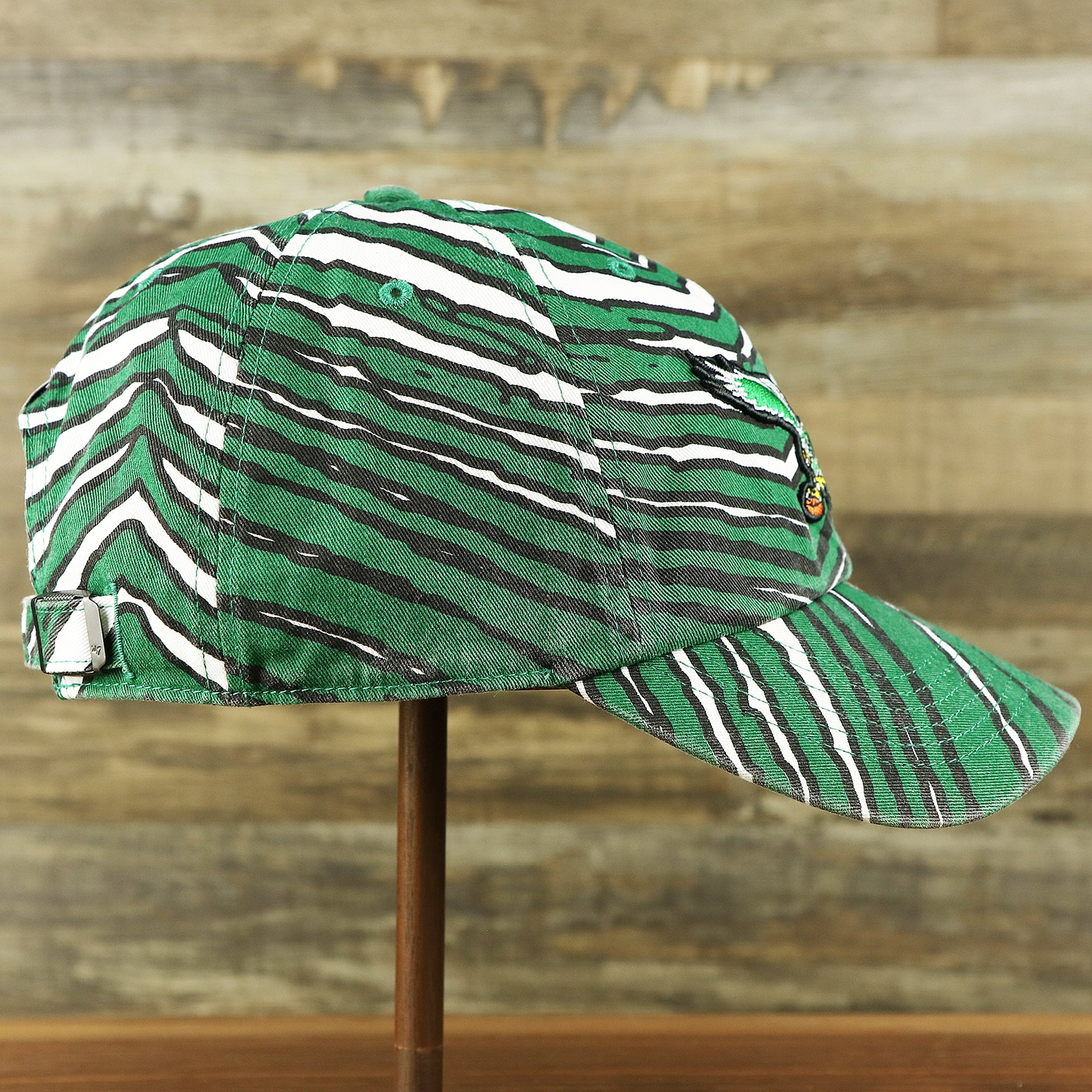 The wearer's right on the Throwback Philadelphia Eagles Zubaz Striped Pattern Dad Hat | Kelly Green Dad Hat