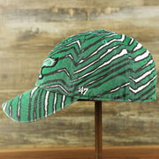 The wearer's left on the Throwback Philadelphia Eagles Zubaz Striped Pattern Dad Hat | Kelly Green Dad Hat