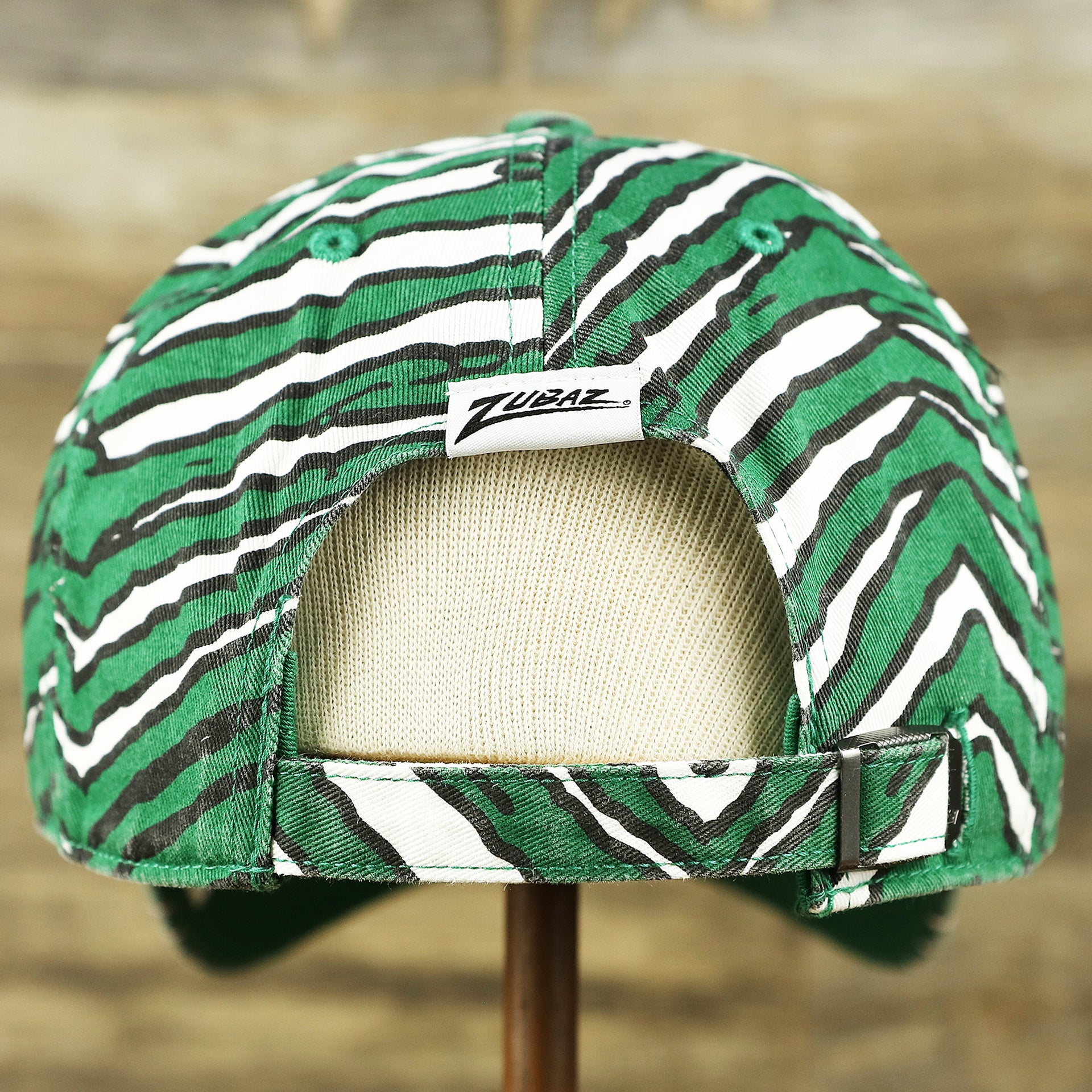 The backside of the Throwback Philadelphia Eagles Zubaz Striped Pattern Dad Hat | Kelly Green Dad Hat