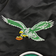 Close up of the Eagles throwback patch on the Philadelphia Eagles Throwback Men’s Vintage Reversible Bomber Jacket | Alpha Industries x New Era