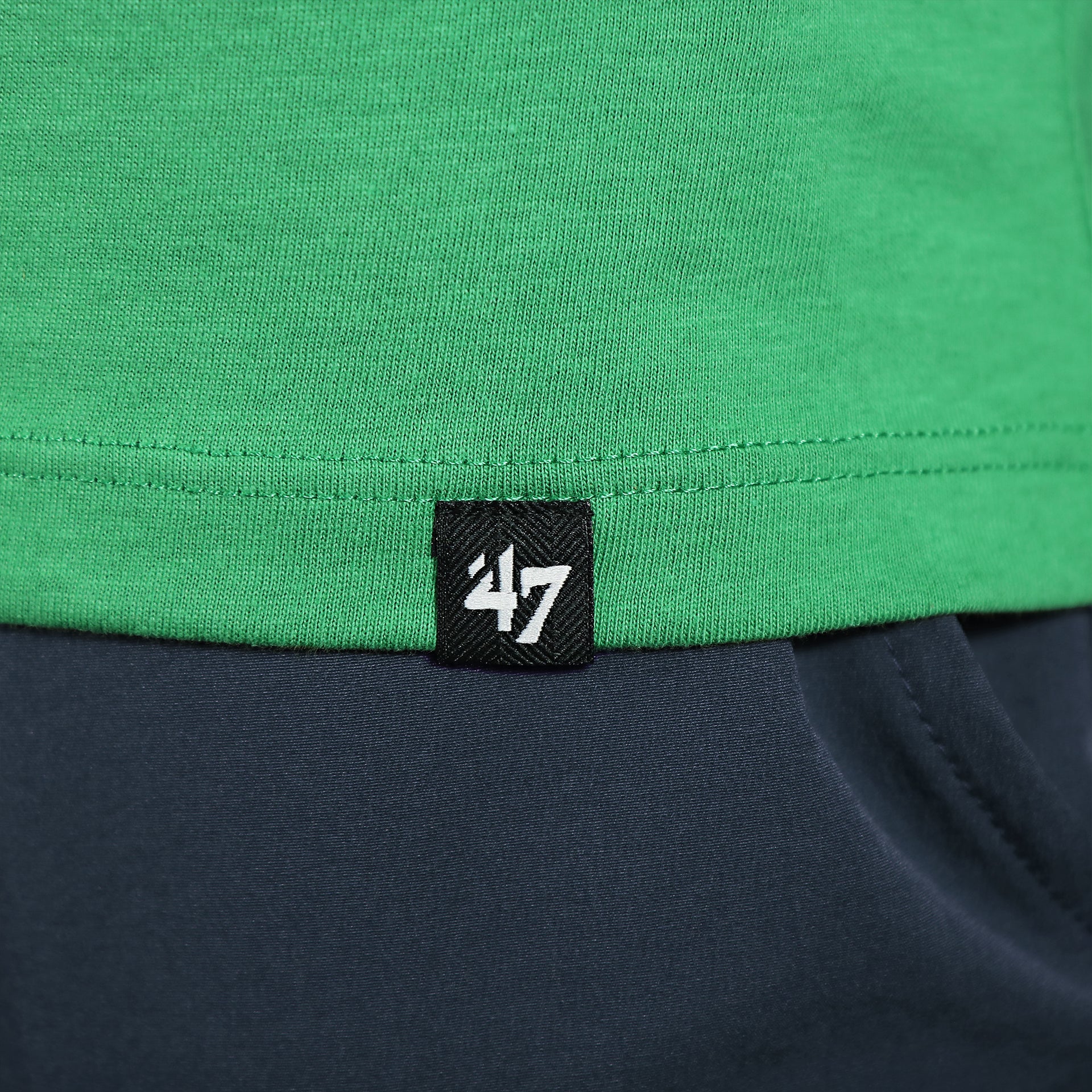 Close up of the 47 brand label on the Philadelphia Eagles Throwback Logo Arch Wordmark Premium Franklin Kelly Green T-Shirt
