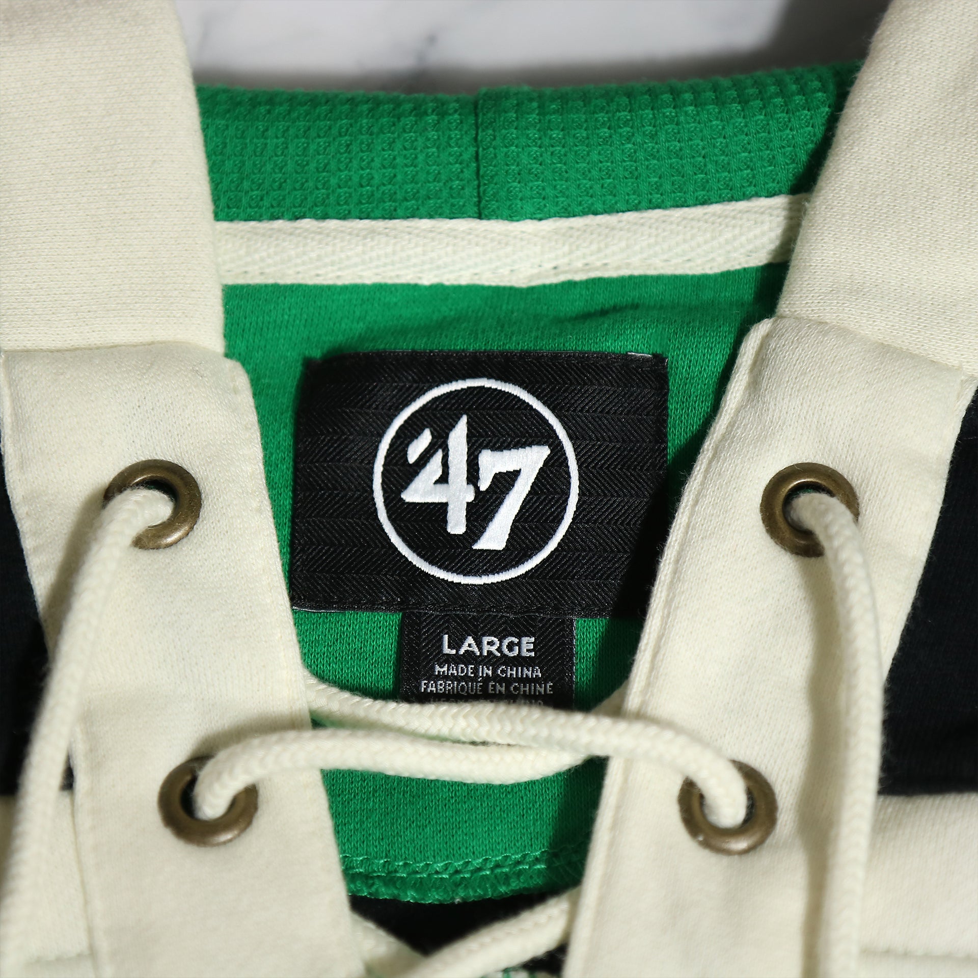 47 brand label on the Philadelphia Eagles Vintage Hockey 47 Lacer Hoodie |  Black, Kelly Green, White