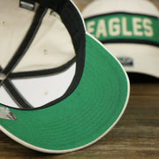 The undervisor on the Throwback Philadelphia Eagles Striped Wordmark Legacy Eagles Side Patch Crossroad Dad Hat | Bone Dad Hat