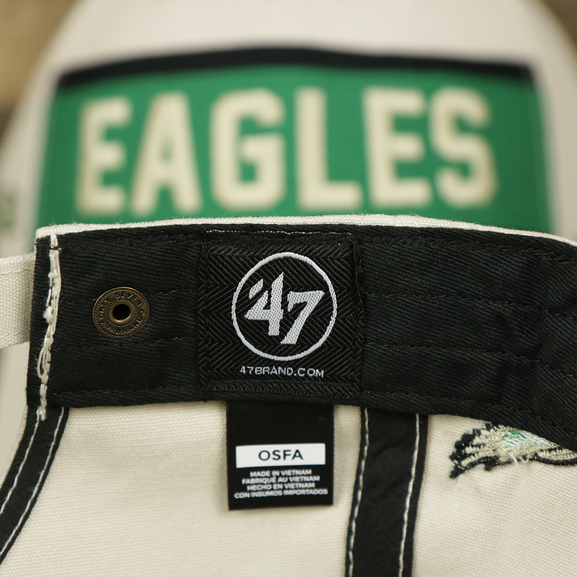 The 47 brand Tag on the Throwback Philadelphia Eagles Striped Wordmark Legacy Eagles Side Patch Crossroad Dad Hat | Bone Dad Hat