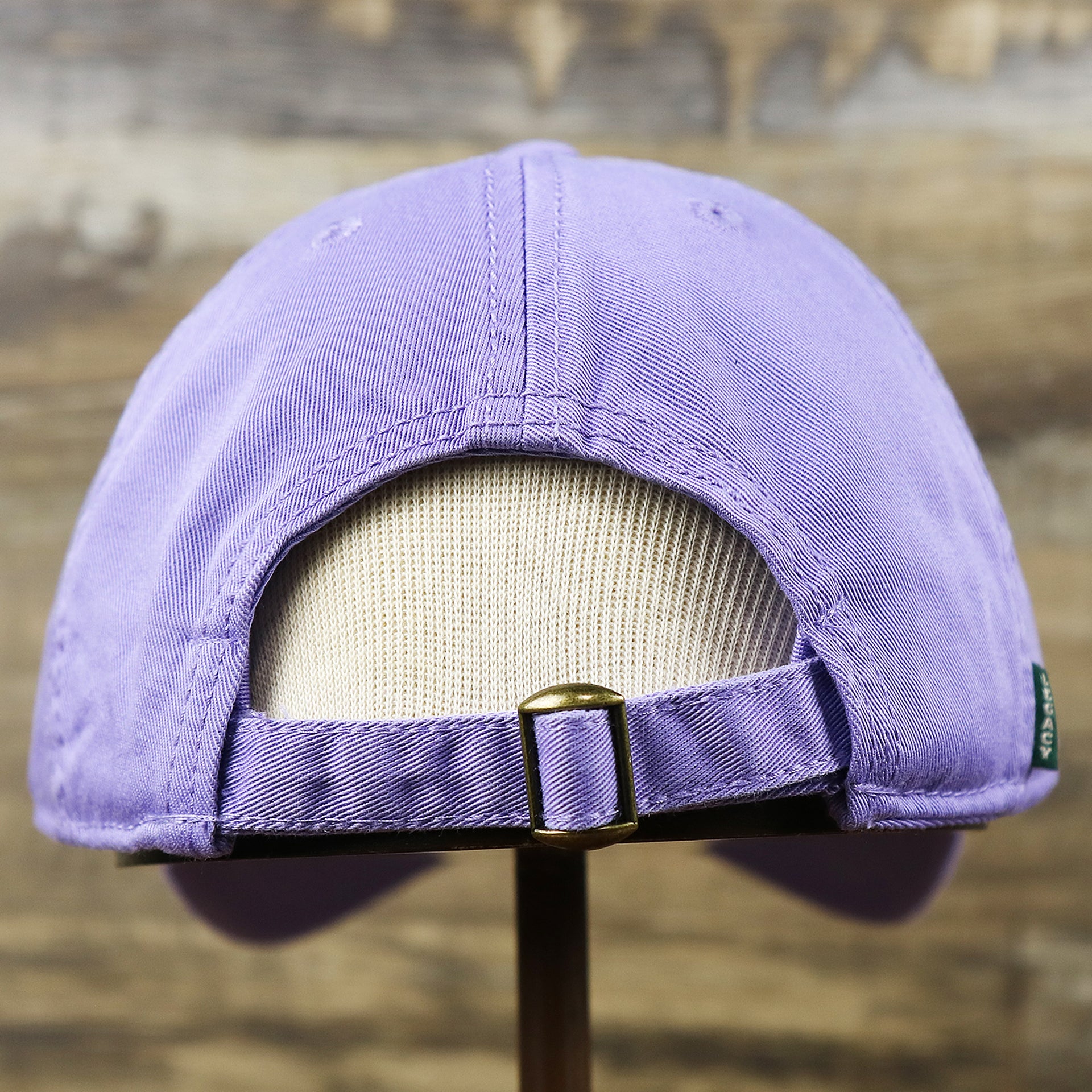 The backside of the Ocean City New Jersey Cursive Wordmark Dad Hat | Lavender Dad Hat