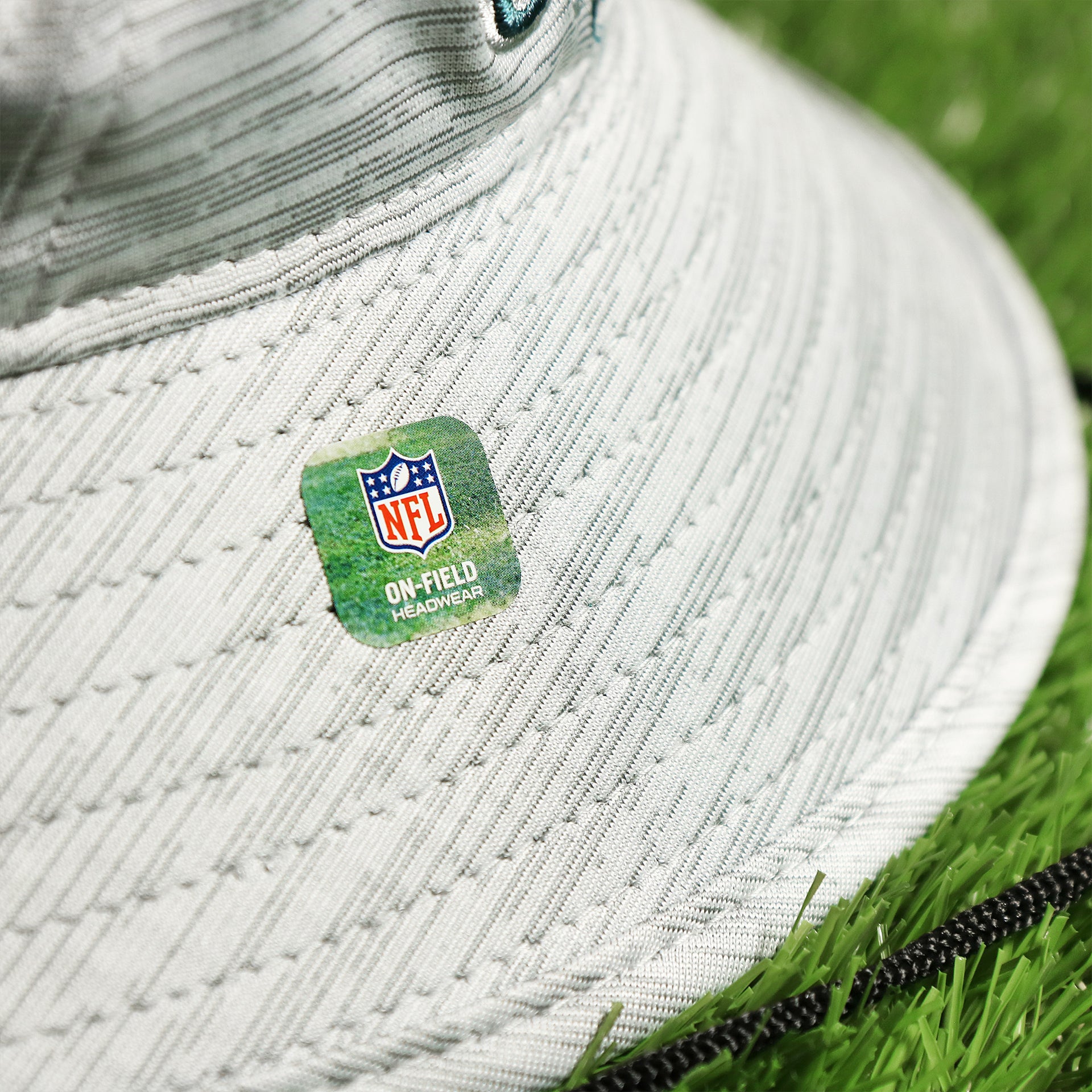 The On Field NFL Sticker on the Philadelphia Eagles Summer Training Camp Short Brim Bucket Hat | Distinct Gray Bucket Hat