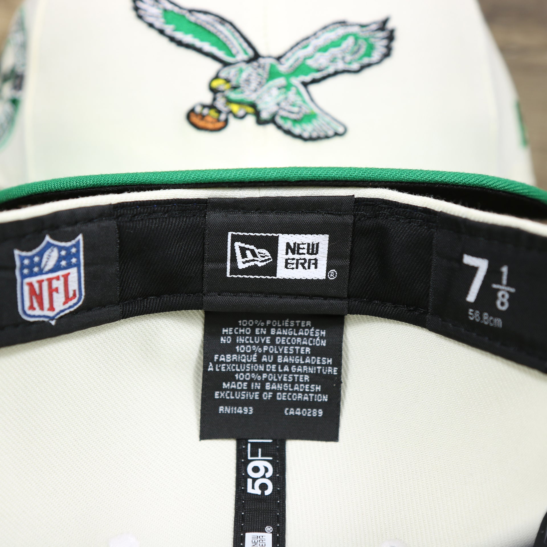 The Tags on the Throwback Philadelphia Eagles Chrome Logo NFL Eagles SIde Patch 59Fifty Fitted Cap | Cream Fitted Cap