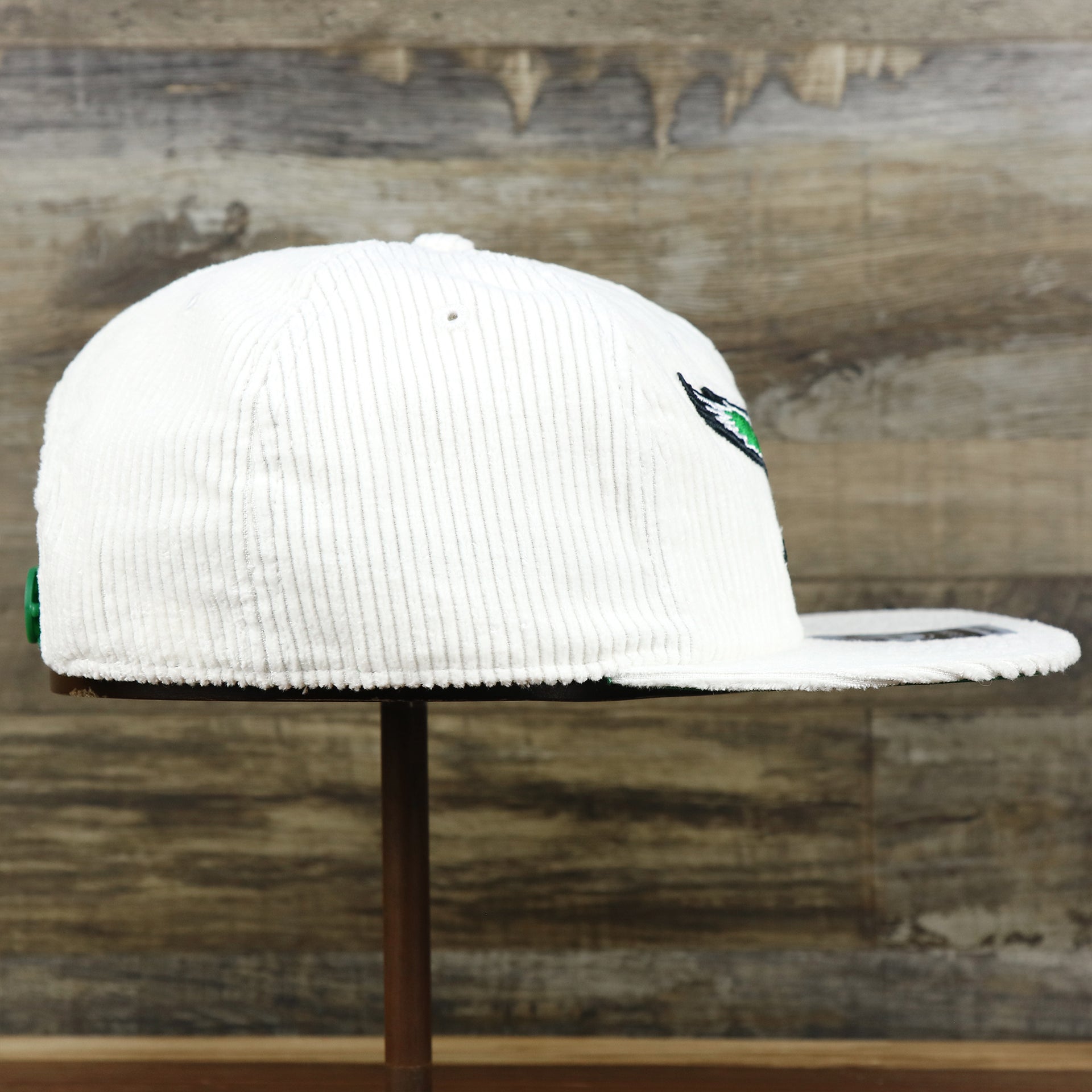 The wearer's right on the Throwback Philadelphia Eagles Corduroy Snapback Hat | White Corduroy Snap Cap