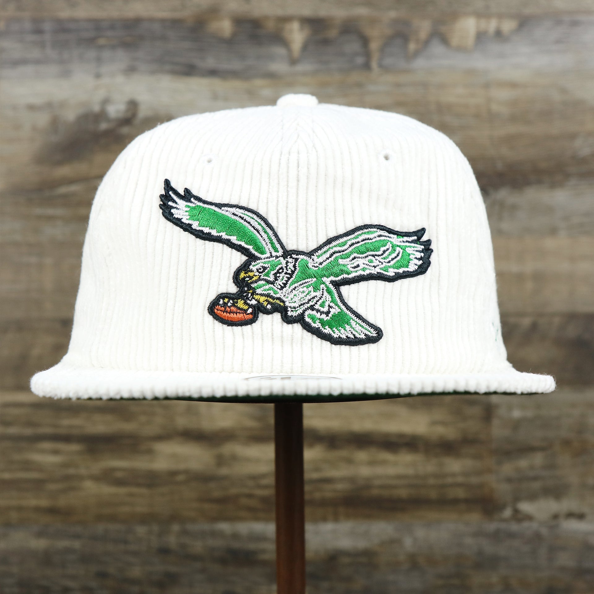 The front of the Throwback Philadelphia Eagles Corduroy Snapback Hat | White Corduroy Snap Cap