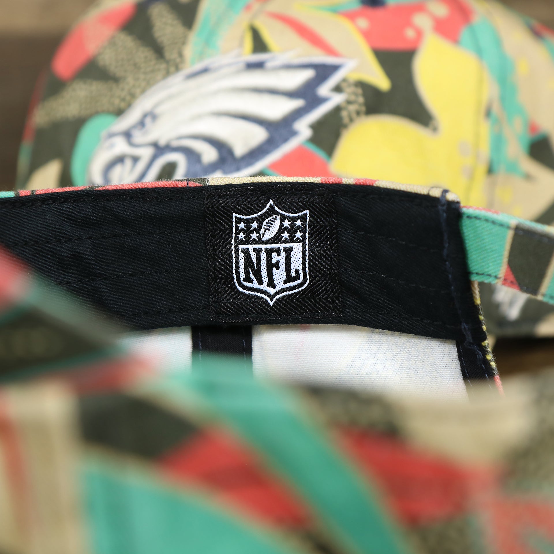 The NFL Tag on the Women’s Philadelphia Eagles All Over Floral Print NFL Dad Hat | Women’s Charcoal Dad Hat