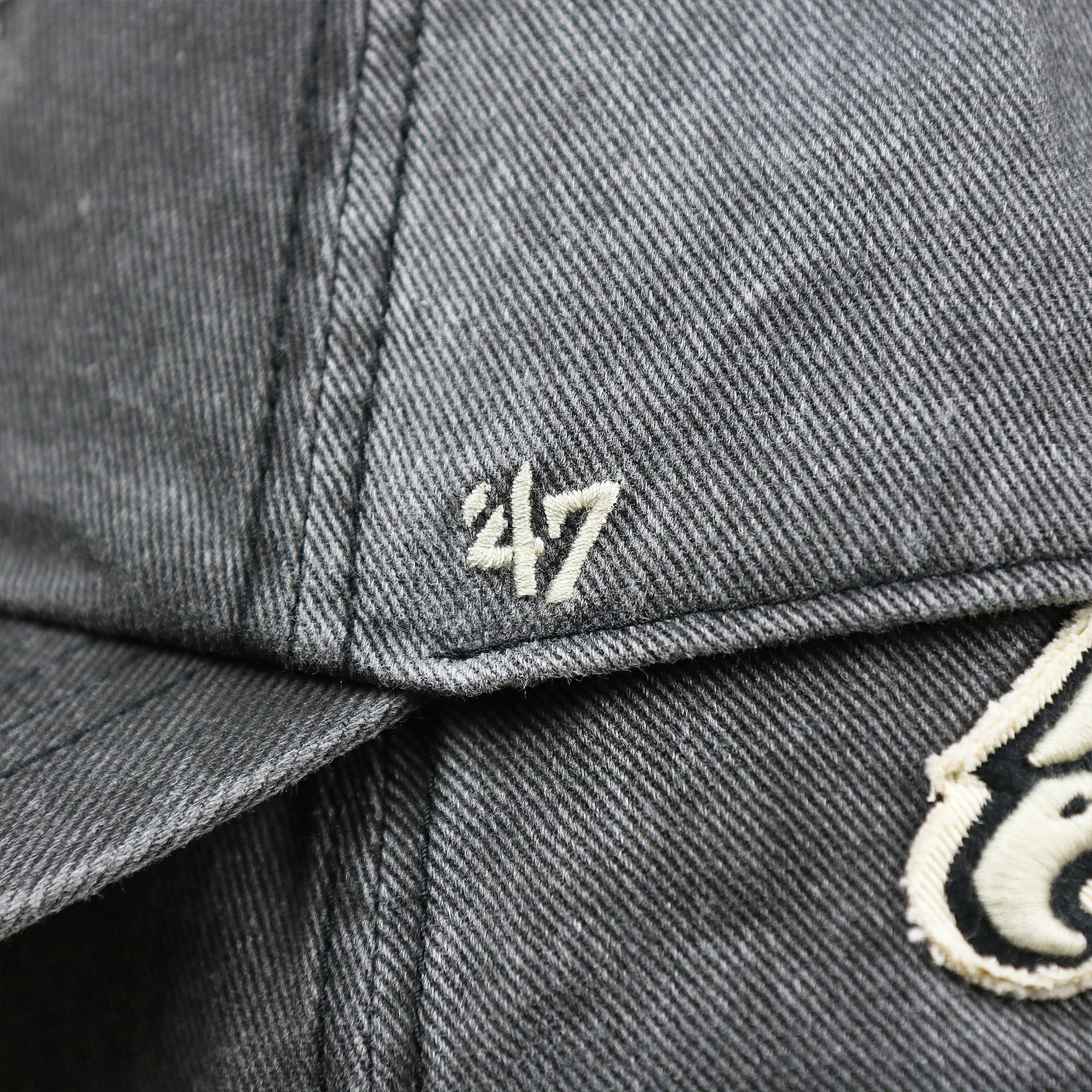 The 47 Brand Logo on the Philadelphia Eagles Worn Dark Gray Dad Hat | Worn Dark Gray Dad Hat