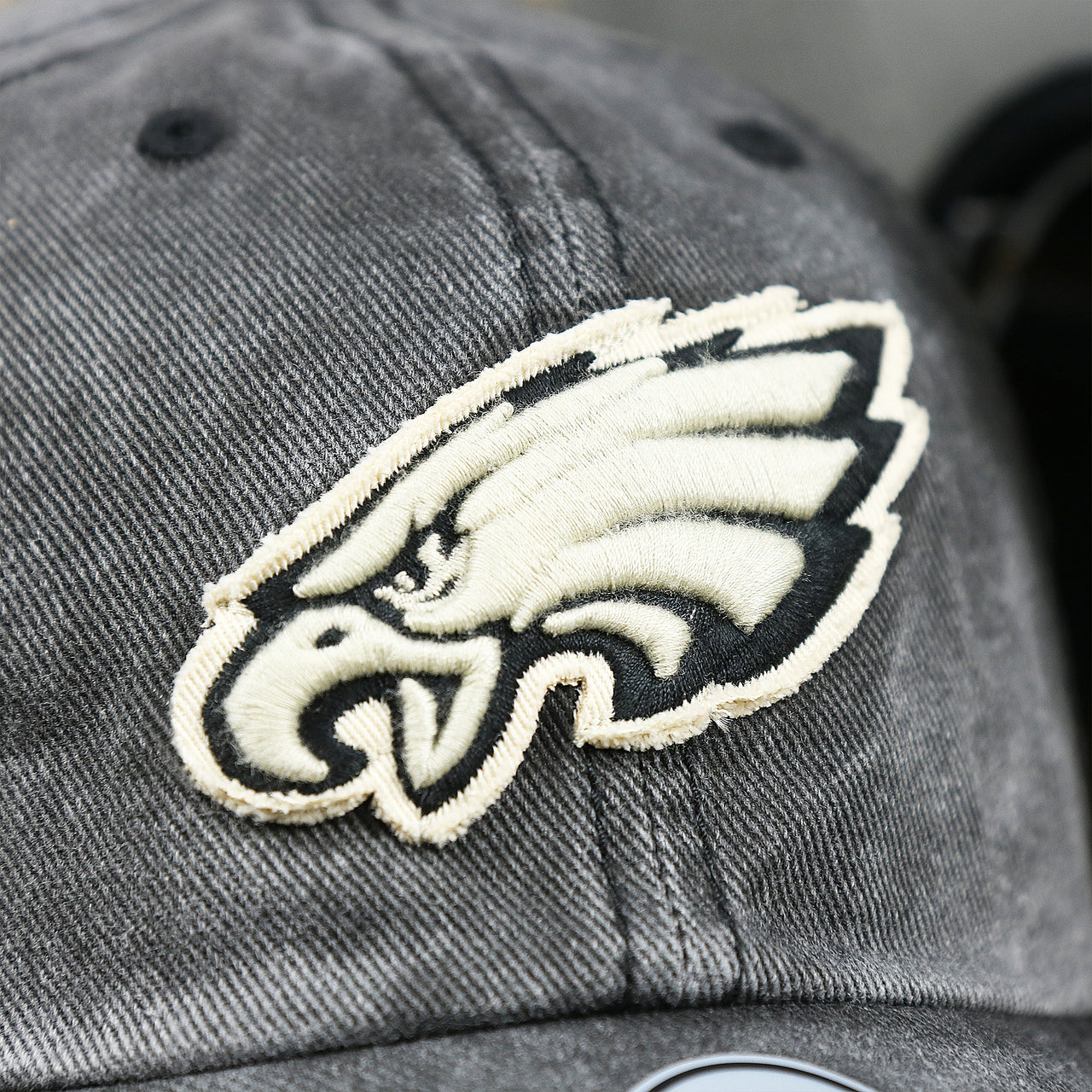 The Eagles Logo on the Philadelphia Eagles Worn Dark Gray Dad Hat | Worn Dark Gray Dad Hat