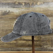 The wearer's left of the Philadelphia Eagles Worn Dark Gray Dad Hat | Worn Dark Gray Dad Hat