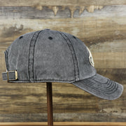 The wearer's right on the Philadelphia Eagles Worn Dark Gray Dad Hat | Worn Dark Gray Dad Hat