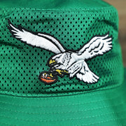 The Throwback Eagles Logo on the Throwback Philadelphia Eagles 1987 White Eagles Logo Panama Pail Bucket Hat | Kelly Green Bucket Hat