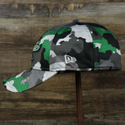 The wearer's left on the Throwback Philadelphia Eagles OnField NFL Summer Training 2022 39Thirty Camo FlexFit Cap | New Era Kelly Green