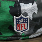The NFL Logo on the Throwback Philadelphia Eagles OnField NFL Summer Training 2022 39Thirty Camo FlexFit Cap | New Era Kelly Green