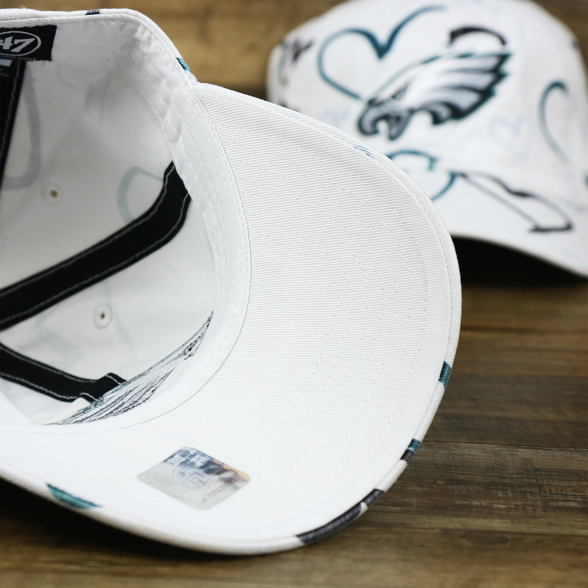 The undervisor on the Kids Philadelphia Eagles Hearts All Over Print Dad Hat | White Kid’s Dad Hat