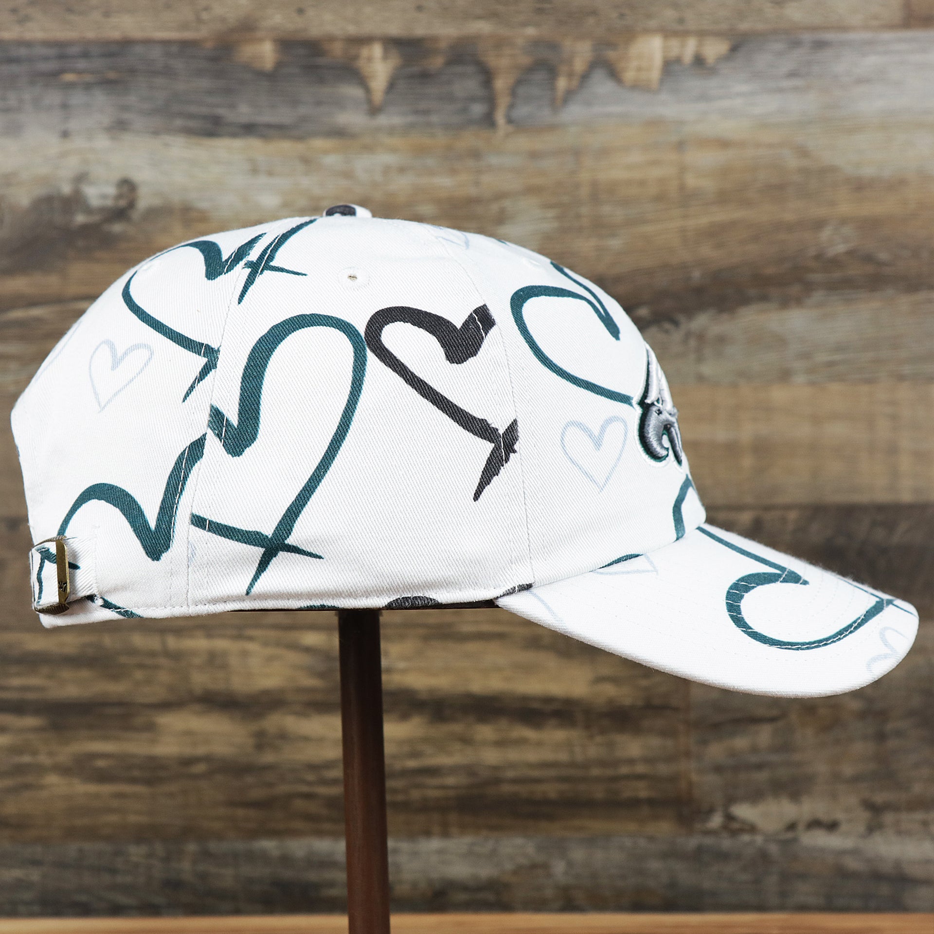 The wearer's right on the Kids Philadelphia Eagles Hearts All Over Print Dad Hat | White Kid’s Dad Hat