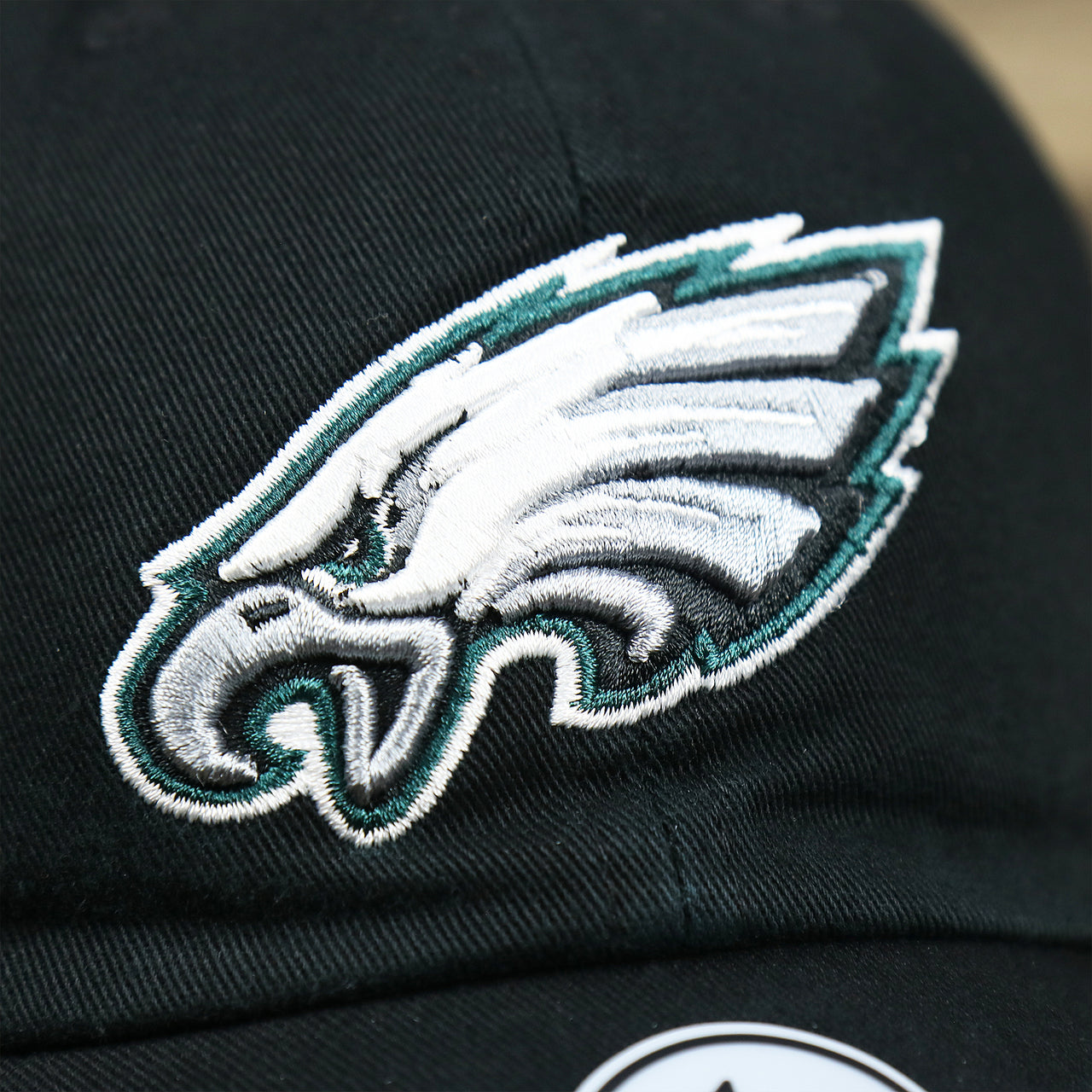 The Eagles Logo on the Philadelphia Eagles Logo Adjustable Dad Hat | Black Dad Hat