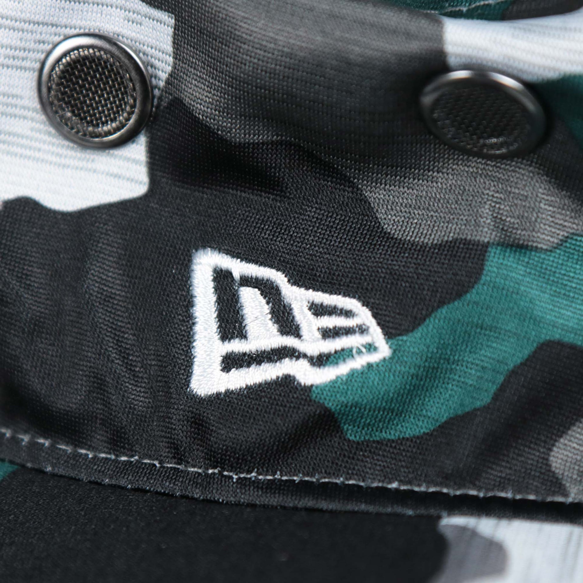 A close up of the New Era Logo embroidered on the