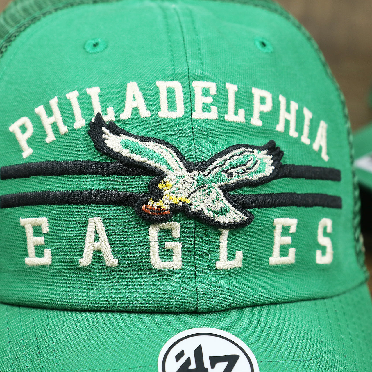 The throwback Eagles Logo on the Throwback Philadelphia Eagles Legacy Logo Highpoint Mesh Back Dad Hat | Mesh Back Kelly Green Dad Hat