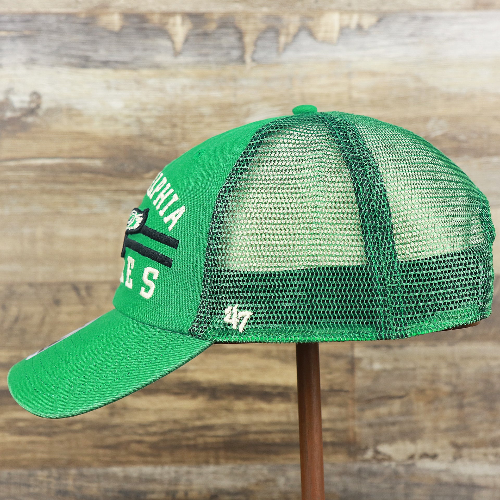 The wearer's left on the Throwback Philadelphia Eagles Legacy Logo Highpoint Mesh Back Dad Hat | Mesh Back Kelly Green Dad Hat