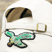 The White Adjustable Strap on the Throwback Philadelphia Eagles Embroidered 1987 Eagles Logo NFL Eagles Side Patch Dad Hat | Bone Dad Hat