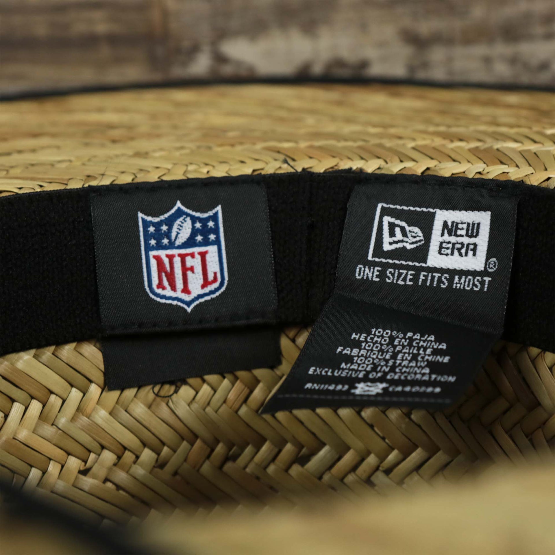 The NFL tag and the New Era tag on the Philadelphia Eagles On Field 2022 Summer Training Straw Hat | New Era OSFM