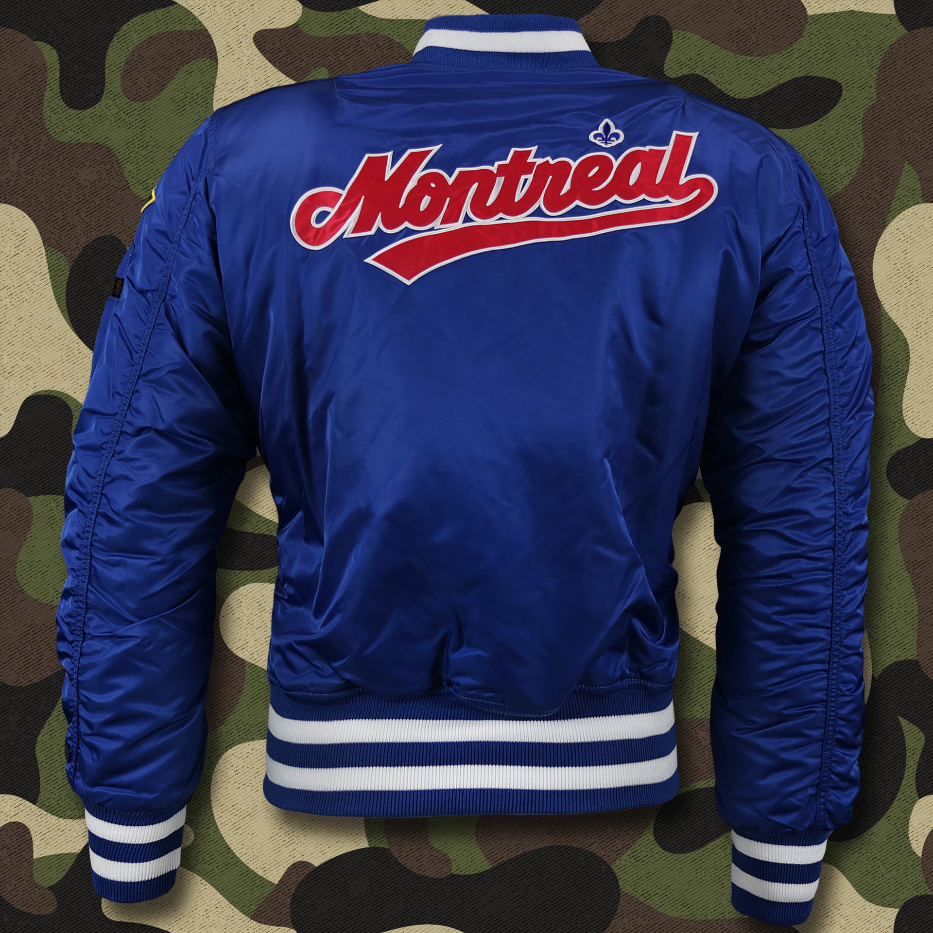 The backside of the Cooperstown Montreal Expos MLB Patch Alpha Industries Reversible Bomber Jacket With Camo Liner | Royal Blue Bomber Jacket