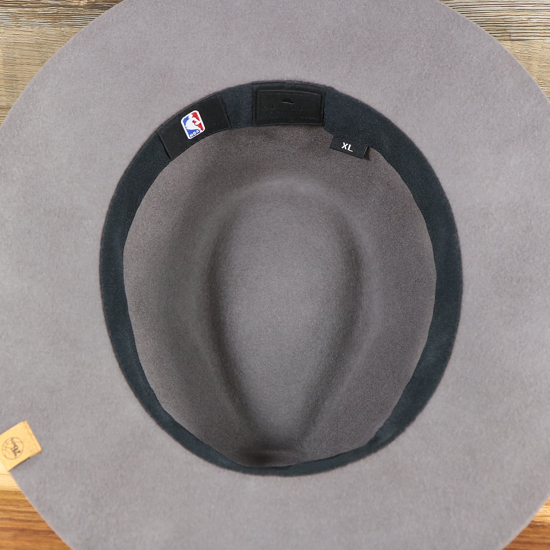 The underside of the Philadelphia 76ers Beaded Wide Brim Fedora Hat With Metal New Era Logo | Gray Fedora Hat