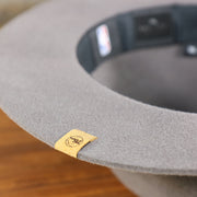 The undervisor on the Philadelphia 76ers Beaded Wide Brim Fedora Hat With Metal New Era Logo | Gray Fedora Hat