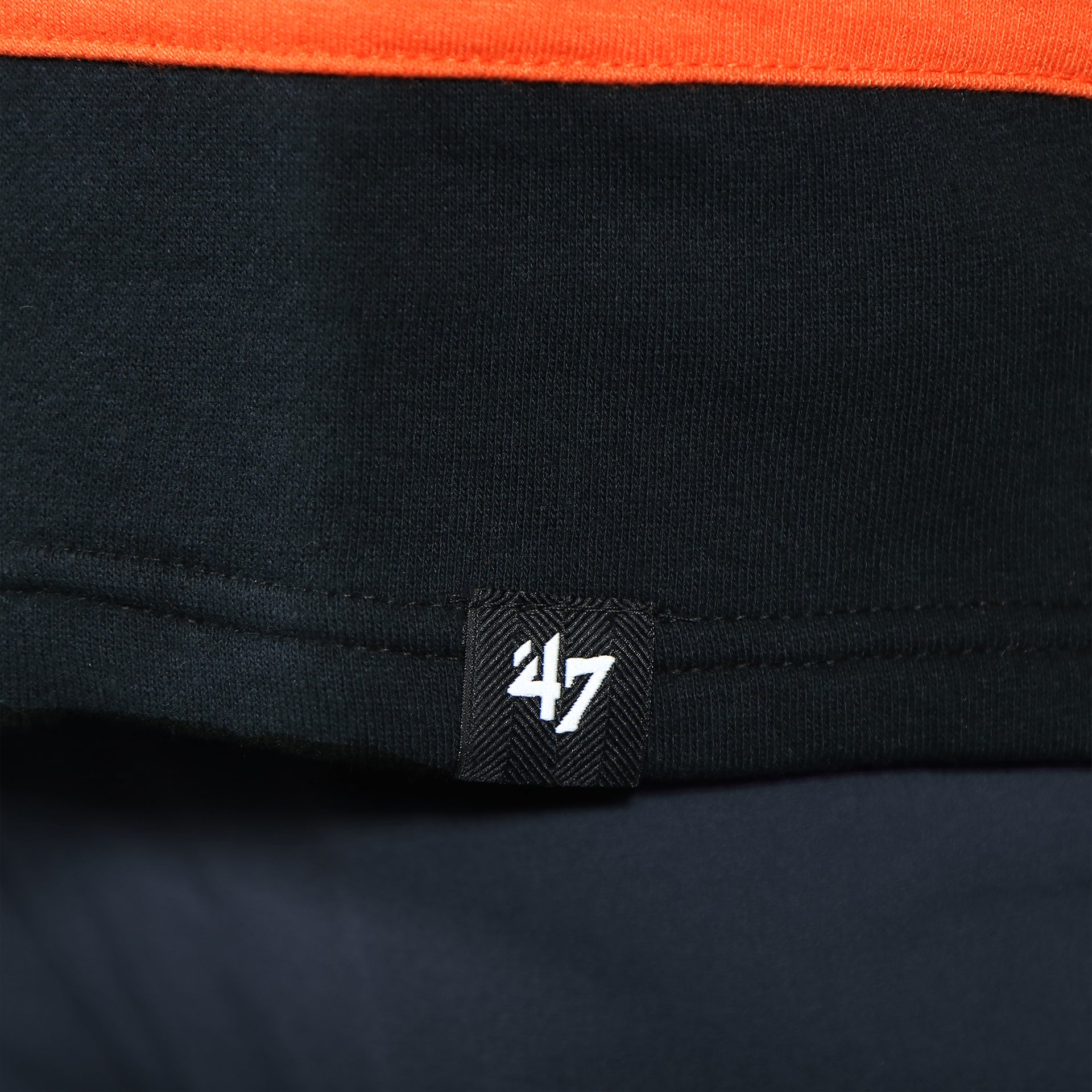 Close up of the 47 label on the Philadelphia Flyers Premium Applique Black/Orange/Cream Lacer Hoodie