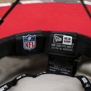 The NFL Tags and New Era Tags on the Atlanta Falcons NFL Summer Training Camp 2022 Camo Bucket Hat | Red Bucket Hat
