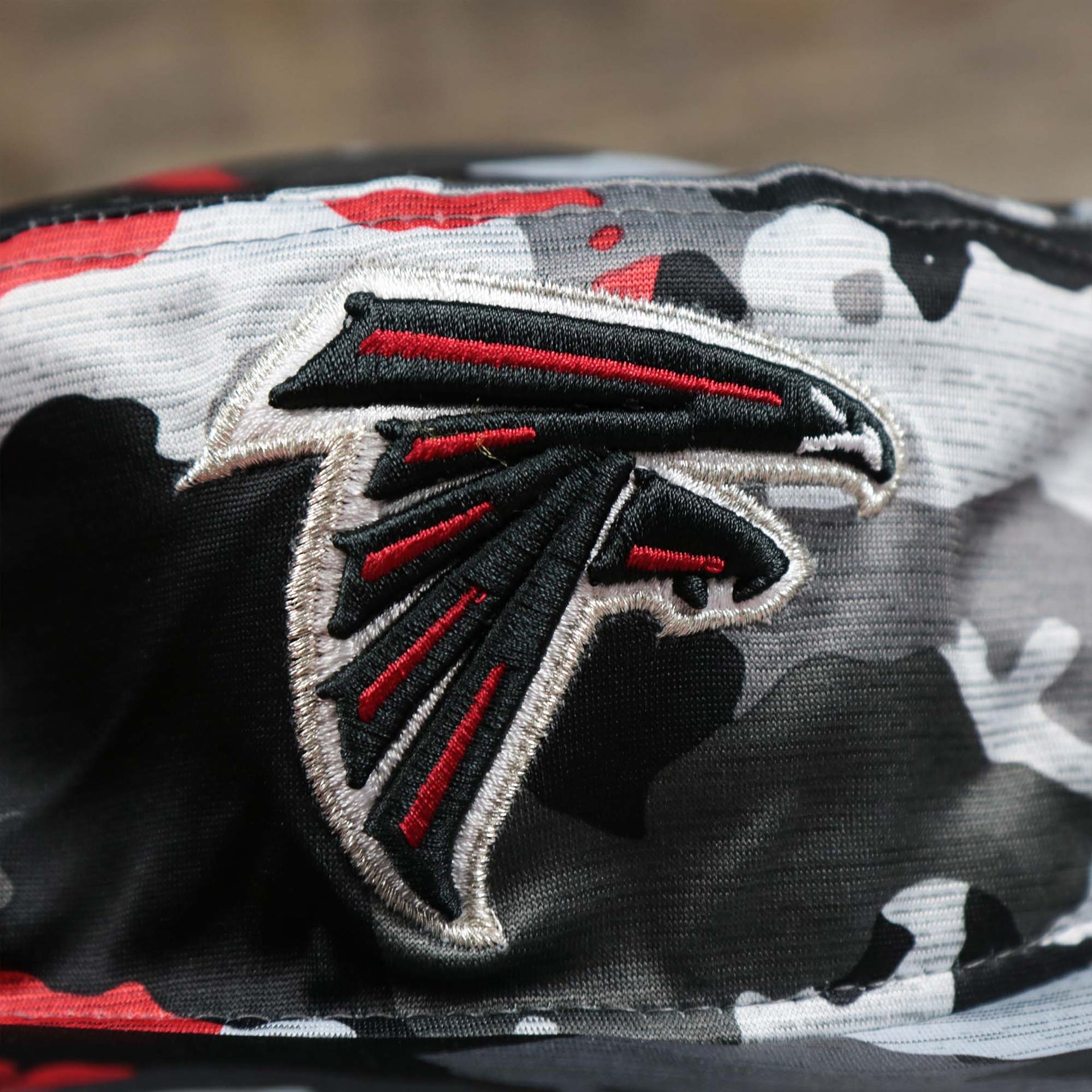 The Falcons Logo on the Atlanta Falcons NFL Summer Training Camp 2022 Camo Bucket Hat | Red Bucket Hat