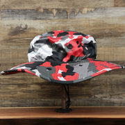 The wearer's right on the Atlanta Falcons NFL Summer Training Camp 2022 Camo Bucket Hat | Red Bucket Hat