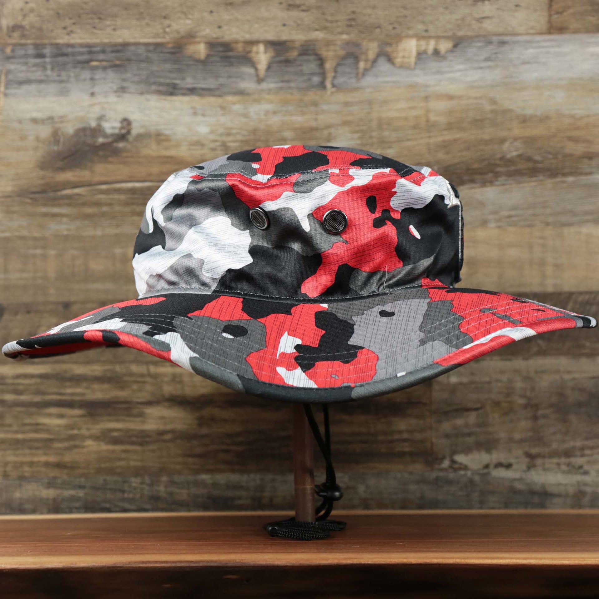 The wearer's right on the Atlanta Falcons NFL Summer Training Camp 2022 Camo Bucket Hat | Red Bucket Hat