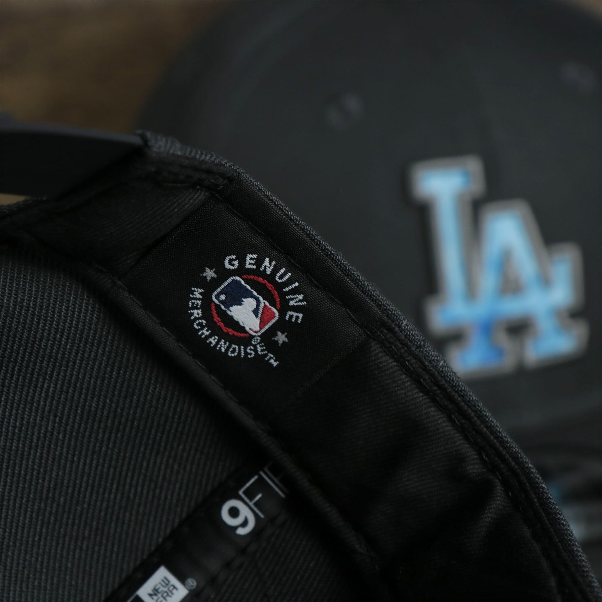 A close up of the MLB Merchandise patch on the Los Angeles Dodgers 2022 Father's Day On-Field 9Fifty Snapback | Gray