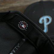 A close up of the MLB Merchandise patch on the Philadelphia Phillies 2022 Father's Day On-Field 9Fifty Snapback | Gray