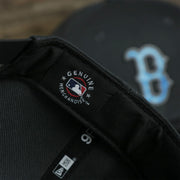 A close up of the MLB Merchandise patch on the Boston Red Sox 2022 Father's Day On-Field 9Fifty Snapback | Gray