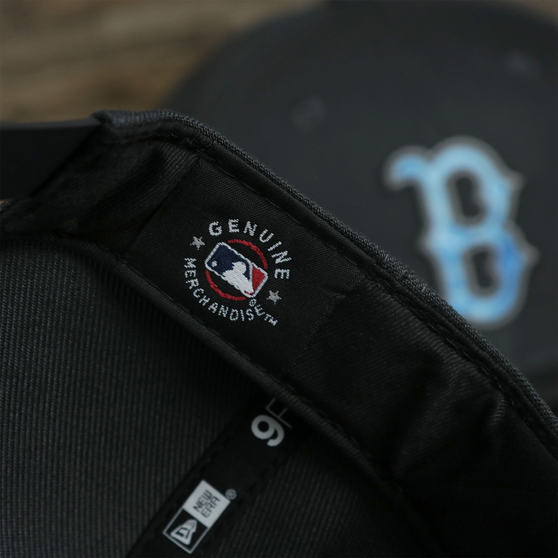 A close up of the MLB Merchandise patch on the Boston Red Sox 2022 Father's Day On-Field 9Fifty Snapback | Gray