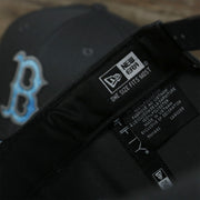 A close up of the item info on the Boston Red Sox 2022 Father's Day On-Field 9Fifty Snapback | Gray
