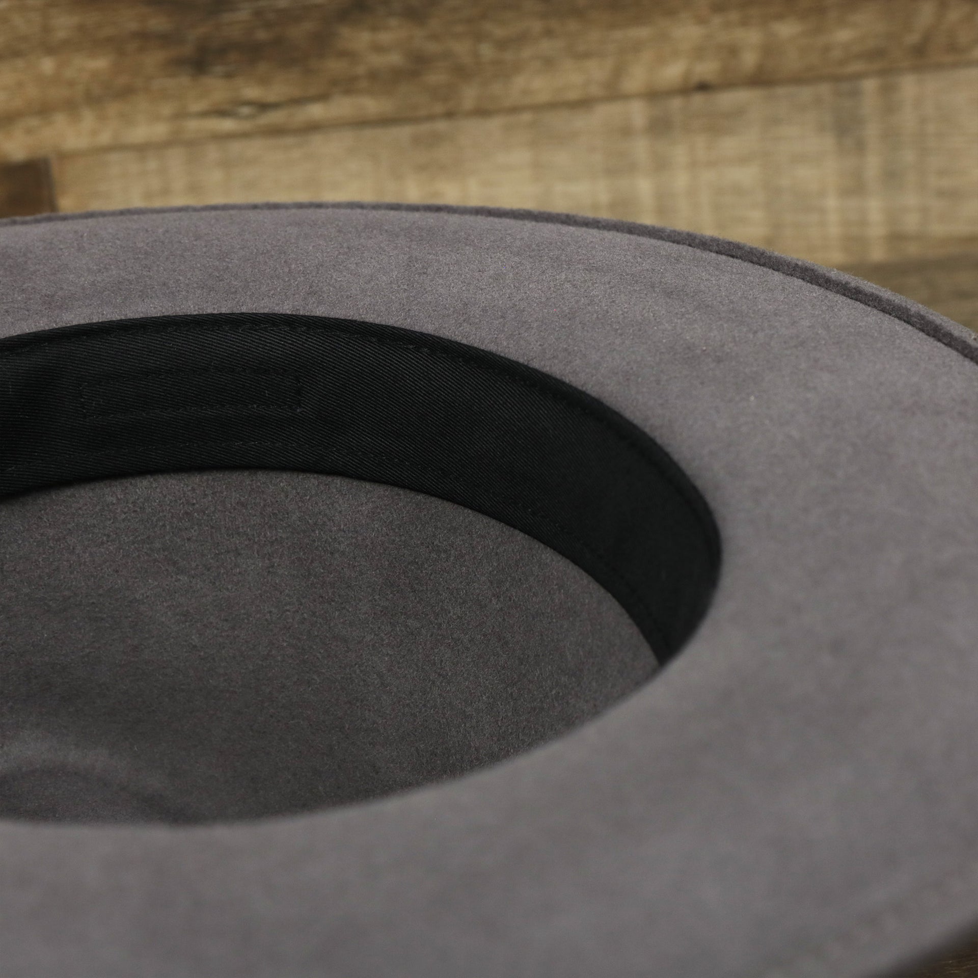 A close up of the underside of the Wide Brim Ribbon Edge Chared Fedora Hat with Brown Paisley Silk Interior | Zertrue 100% Australian Wool