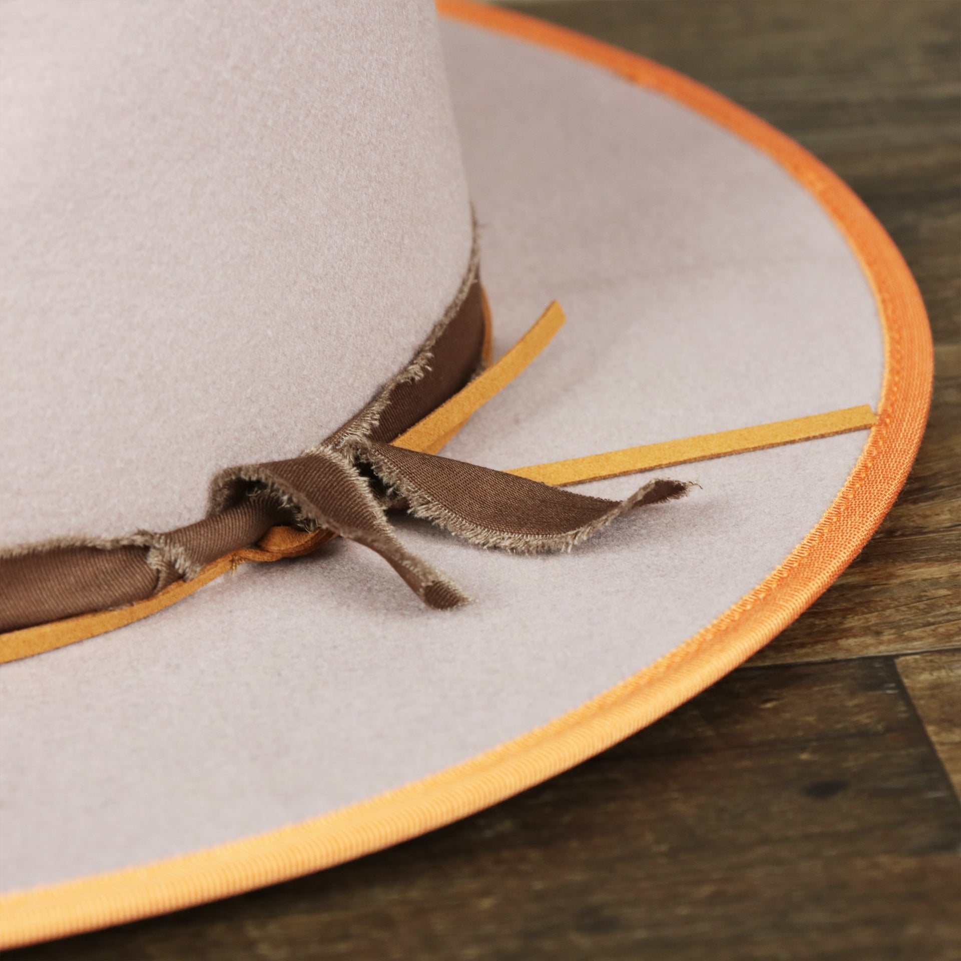 A close up of the ribbon on the Wide Brim Ribbon Trim Gray Fedora Hat with Brown Paisley Silk Interior | Zertrue 100% Australian Wool