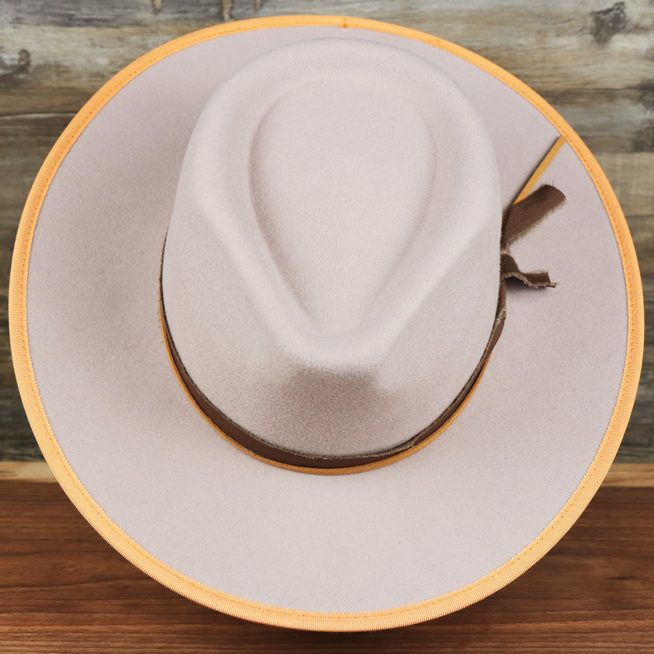 An overhead view of the Wide Brim Ribbon Trim Gray Fedora Hat with Brown Paisley Silk Interior | Zertrue 100% Australian Wool
