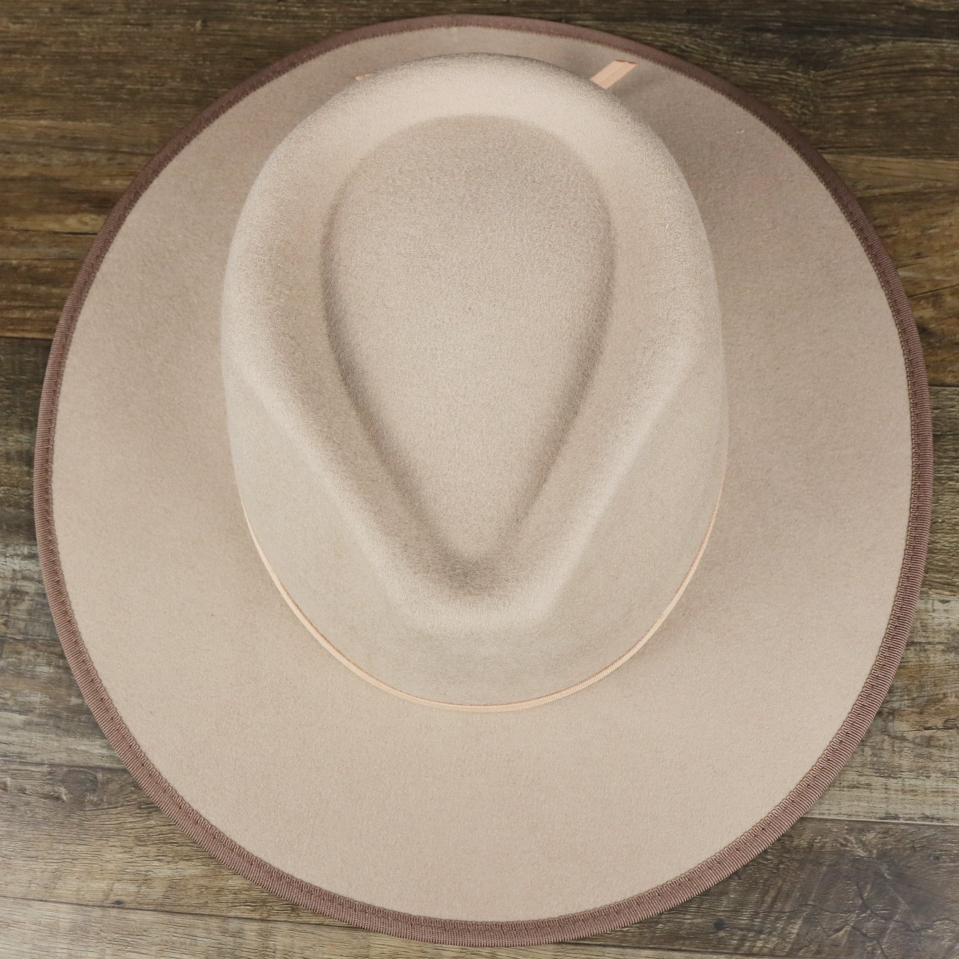 An overhead view of the Wide Brim Ribbon Edge Taupe Fedora Hat with Brown Paisley Silk Interior | Zertrue 100% Australian Wool