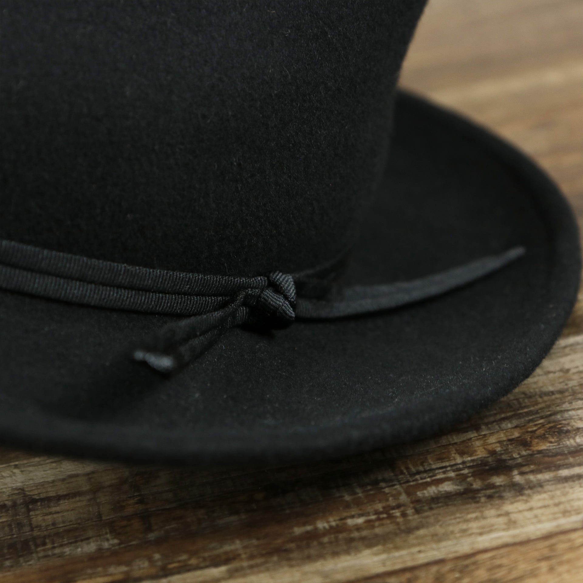 a close up of the ribbon on the Can Can Australian Wool Small Brim Folded Edge Fedora Hat with Brown Silk Interior | Brown
