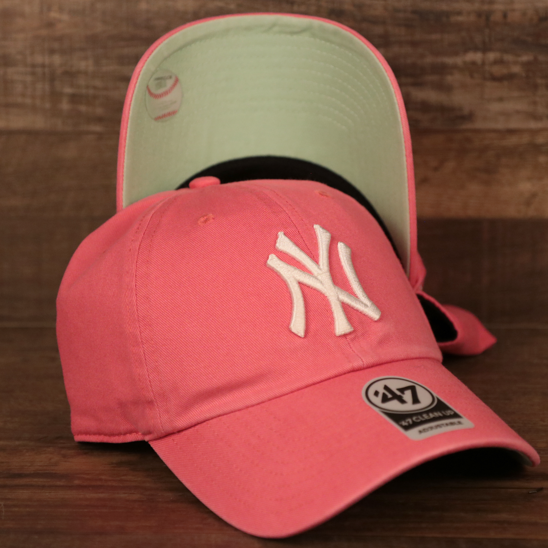 Top and Bottom view of this adjustable New York Yankees green bottom baseball hat.